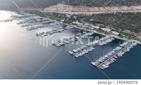 Coastal mountain landscape, sea resort yachts, golden hour Coastal mountain landscape, sea resort yachts, golden hour 140490079