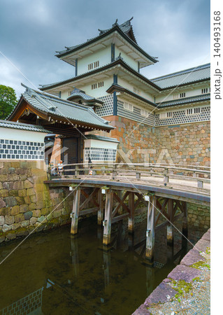 Kanazawa, Japan - Oct 6 2024, vertical view of facade of Kanazawa Castle with the moat in the foreground, on a cloudy day, without people, at daytime, Kanazawa, Japan  140493168