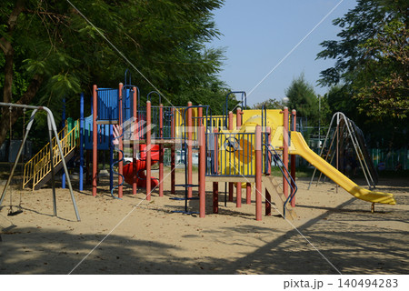 Climbing structures and slides are playground equipment for children, which are part of the Lumpini public park in Bangkok capital city , Thailand. Climbing structures and slides are playground equipment for children, which are part of the Lumpini public park in Bangkok capital city , Thailand. 140494283