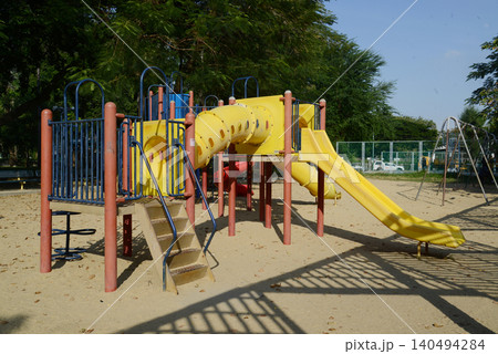 Climbing structures and slides are playground equipment for children, which are part of the Lumpini public park in Bangkok capital city , Thailand. Climbing structures and slides are playground equipment for children, which are part of the Lumpini public park in Bangkok capital city , Thailand. 140494284