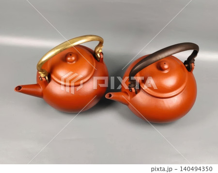 Two Traditional Chinese Yixing Clay Teapots with Metallic Handles Two Traditional Chinese Yixing Clay Teapots with Metallic Handles 140494350