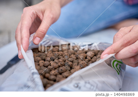 Clay pebbles for plant pot drainage 140498869