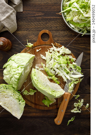 Cabbage cut and shredded. Fresh raw white chopped Cabbage Cabbage cut and shredded. Fresh raw white chopped Cabbage 140499052