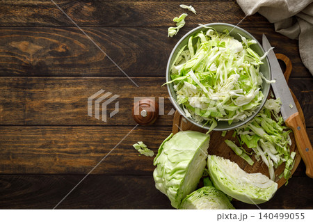 Cabbage cut and shredded. Fresh raw white chopped Cabbage Cabbage cut and shredded. Fresh raw white chopped Cabbage 140499055