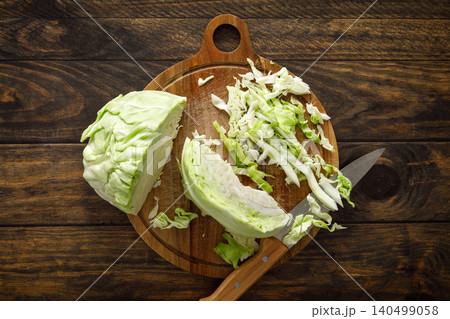 Cabbage cut and shredded. Fresh raw white chopped Cabbage Cabbage cut and shredded. Fresh raw white chopped Cabbage 140499058