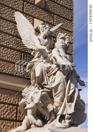 Sculptures of figures and creatures decorate a building facade Sculptures of figures and creatures decorate a building facade 140499636