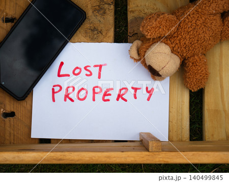 Children toy teddy bear in a wooden lost property box Children toy teddy bear in a wooden lost property box 140499845