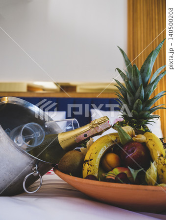 tropical fruits and wine in hotel room tropical fruits and wine in hotel room 140500208