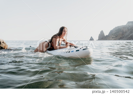 Woman Paddleboarding Ocean Coastline, Paddleboarding Adventure, Water Sports Woman Paddleboarding Ocean Coastline, Paddleboarding Adventure, Water Sports 140500542