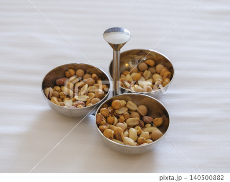 delicious snack nuts on the bed delicious snack nuts on the bed 140500882
