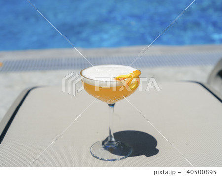 delicious cocktail by the pool delicious cocktail by the pool 140500895