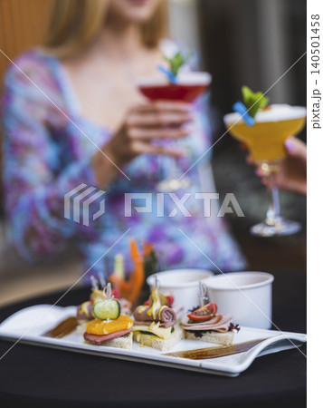 women drinking at a celebration 140501458