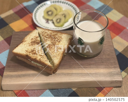 Golden, crispy toast topped with butter and jam, perfect for breakfast or snack-related projects. This image captures the warmth and comfort of a simple yet satisfying meal. 140502575