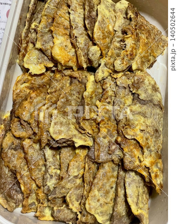 Crispy and savory yukjeon, Korean-style pan-fried battered beef with a golden, flavorful coating. A delicious and tender dish, perfect as a side or snack for a satisfying meal. Crispy and savory yukjeon, Korean-style pan-fried battered beef with a golden, flavorful coating. A delicious and tender dish, perfect as a side or snack for a satisfying meal. 140502644