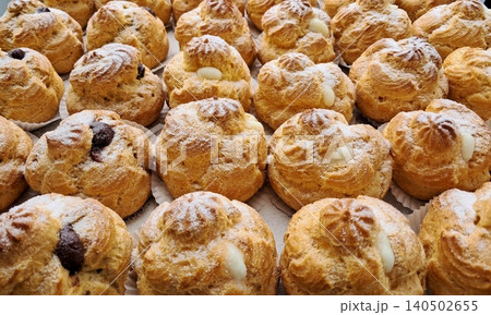 Light and airy choux pastry with a golden crust, filled with rich cream or custard. This elegant and versatile dessert offers a perfect balance of texture and sweetness. Light and airy choux pastry with a golden crust, filled with rich cream or custard. This elegant and versatile dessert offers a perfect balance of texture and sweetness. 140502655