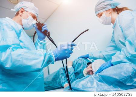 Endoscopy at the hospital. Doctor holding endoscope before gastroscopy Endoscopy at the hospital. Doctor holding endoscope before gastroscopy 140502755