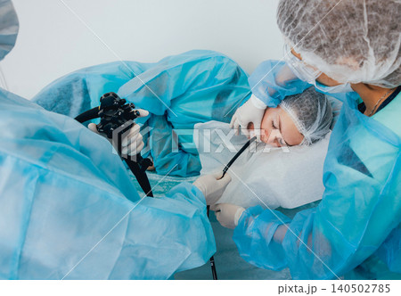 Endoscopy at the hospital. Doctor holding endoscope before gastroscopy Endoscopy at the hospital. Doctor holding endoscope before gastroscopy 140502785