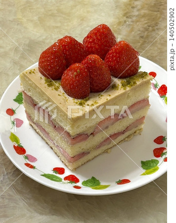 Strawberry cake with soft fluffy layers, topped with fresh strawberries and smooth cream, showcasing vibrant red fruit, delicate textures, and sweet inviting appearance in close-up detail Strawberry cake with soft fluffy layers, topped with fresh strawberries and smooth cream, showcasing vibrant red fruit, delicate textures, and sweet inviting appearance in close-up detail 140502902