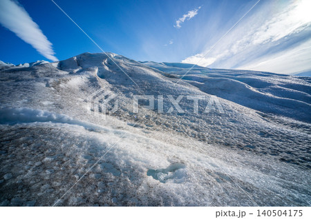 Perito moreno glaciers ice landscape under blue sky with rugged frozen texture across remote patagonia wilderness Perito moreno glaciers ice landscape under blue sky with rugged frozen texture across remote patagonia wilderness 140504175