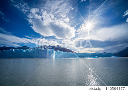 Perito moreno glaciers ice lake mountain panorama under bright sun with blue sky over patagonia water Perito moreno glaciers ice lake mountain panorama under bright sun with blue sky over patagonia water 140504177