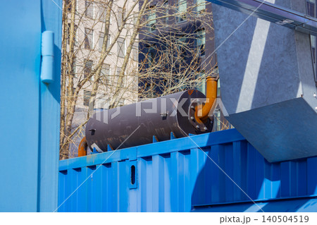 Industrial Equipment and Utility Infrastructure: A Detailed View of Pipework and Container Elements in an Urban Environment Industrial Equipment and Utility Infrastructure: A Detailed View of Pipework and Container Elements in an Urban Environment 140504519