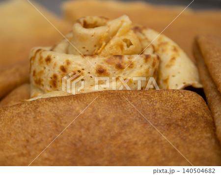 Crepes stacked on plate in close-up view, homemade breakfast or dessert food Crepes stacked on plate in close-up view, homemade breakfast or dessert food 140504682