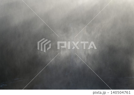 Powerful dark mysterious mist and water spray rising from iguazu falls 140504761