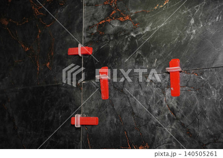 Close-Up View of Tile Spacers Used in Home Improvement Projects for Accurate Tile Installation 140505261
