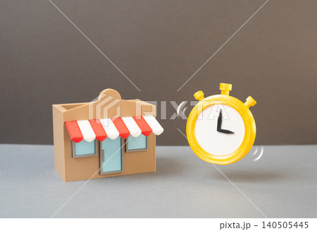 A store and a stopwatch representing business deadlines and commercial opportunities. Leasing a plot of land or premises, franchise development and market expansion. A store and a stopwatch representing business deadlines and commercial opportunities. Leasing a plot of land or premises, franchise development and market expansion. 140505445