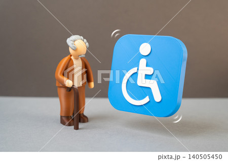 An elderly man and a disability symbol representing social support eligibility. Registration of a disability group, pension access and receipt of social benefits. An elderly man and a disability symbol representing social support eligibility. Registration of a disability group, pension access and receipt of social benefits. 140505450