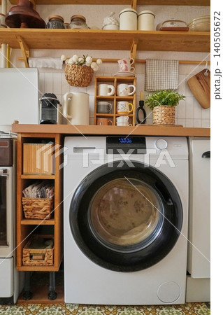 Modern Laundry Room Design Featuring a Stylish Washing Machine and Practical Storage Solutions Modern Laundry Room Design Featuring a Stylish Washing Machine and Practical Storage Solutions 140505672