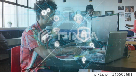 Working woman in red plaid short-sleeve shirt focusing on laptop at shared workspace, with AR HUD Working woman in red plaid short-sleeve shirt focusing on laptop at shared workspace, with AR HUD 140505691