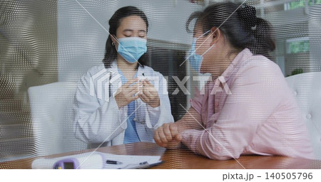 Masked doctor in lab coat and stethoscope preparing syringe in clinic room, with dotted partition Masked doctor in lab coat and stethoscope preparing syringe in clinic room, with dotted partition 140505796