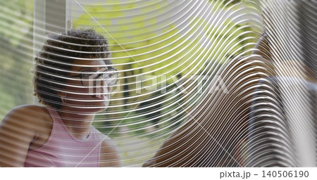 Sitting woman in pink tank top at cafe facing right through ribbed glass, eyeglasses, copy space Sitting woman in pink tank top at cafe facing right through ribbed glass, eyeglasses, copy space 140506190