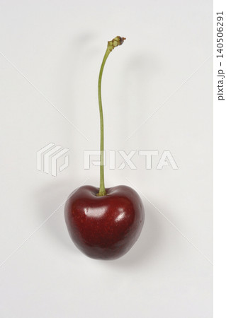 Single ripe cherry with stem on white background 140506291