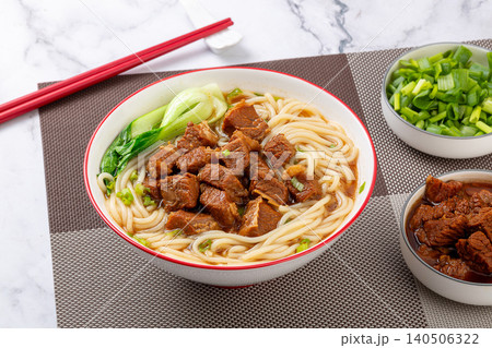 Traditional Chinese Braised Beef Rice Noodles with Bok Choy and Scallions. Authentic Asian Beef Noodle Soup in white Bowl. Traditional Chinese Braised Beef Rice Noodles with Bok Choy and Scallions. Authentic Asian Beef Noodle Soup in white Bowl. 140506322