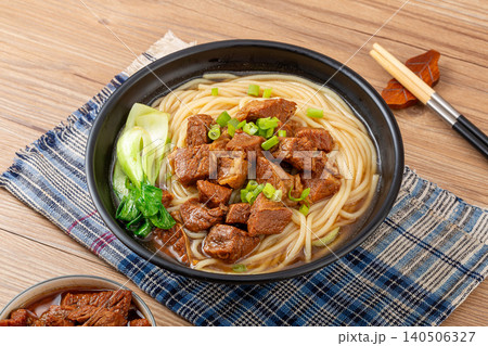 Traditional Chinese Braised Beef Rice Noodles with Bok Choy and Scallions. Authentic Asian Beef Noodle Soup in black Bowl. Traditional Chinese Braised Beef Rice Noodles with Bok Choy and Scallions. Authentic Asian Beef Noodle Soup in black Bowl. 140506327