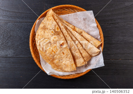 Whole Wheat Flatbread Wraps on Wooden Board Whole Wheat Flatbread Wraps on Wooden Board 140506352
