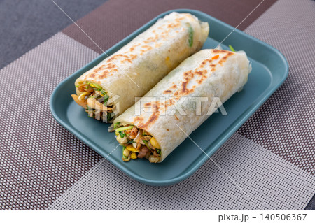 Savory Wheat Wrap Roll with Vegetables and Egg, Chinese Street Food Snack Savory Wheat Wrap Roll with Vegetables and Egg, Chinese Street Food Snack 140506367