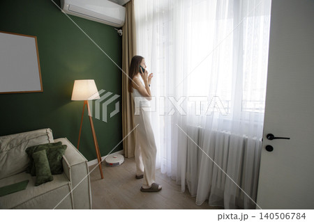 Attractive woman using smartphone indoor 140506784
