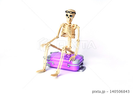 A Fun Skeleton Sitting on a Purple Suitcase with Glasses, Ready for Adventure or Travel A Fun Skeleton Sitting on a Purple Suitcase with Glasses, Ready for Adventure or Travel 140506843