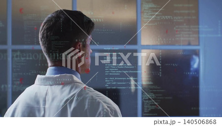 Analyzing researcher in lab coat in control-room viewing code on glass with monitors, copy space Analyzing researcher in lab coat in control-room viewing code on glass with monitors, copy space 140506868