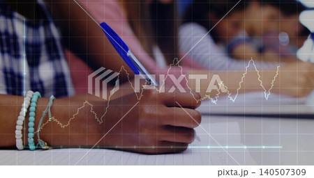 Writing right hand wearing bracelets holding blue pen on lined paper in class, plaid shirt, overlay Writing right hand wearing bracelets holding blue pen on lined paper in class, plaid shirt, overlay 140507309