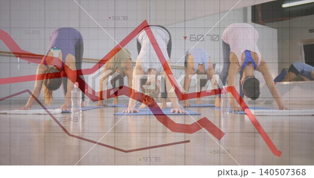 Doing downward dog poses five adults wearing activewear in fitness studio, with mats and red charts Doing downward dog poses five adults wearing activewear in fitness studio, with mats and red charts 140507368