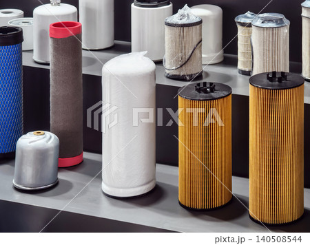 Different types of filters arranged on shelves in a store for automotive and industrial use 140508544