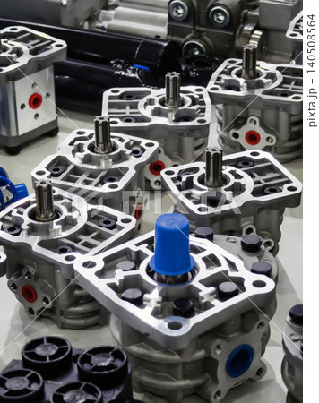 Various mechanical components of junction boxes are arranged closely on a workbench Various mechanical components of junction boxes are arranged closely on a workbench 140508564