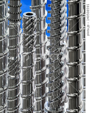 Metal screws and bolts arranged in a close-up view showing detail of their design and structure in a workshop setting Metal screws and bolts arranged in a close-up view showing detail of their design and structure in a workshop setting 140508591