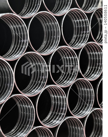 Pipes arranged in a factory setting showing metal construction and industrial design 140508611