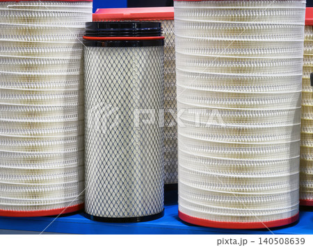 Different sizes of air filters displayed on a blue shelf in a storage area for industrial supplies Different sizes of air filters displayed on a blue shelf in a storage area for industrial supplies 140508639