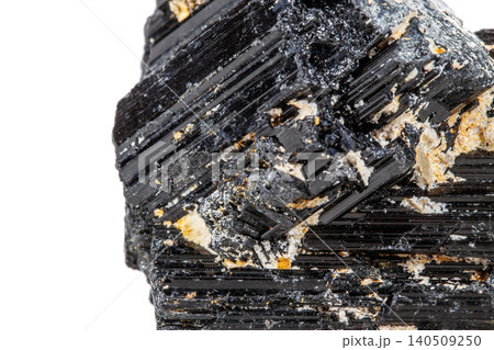 macro mineral stone sherle, schorl, black tourmaline on white background macro mineral stone sherle, schorl, black tourmaline on white background 140509250